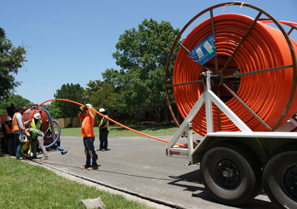 TexStar Technicians laying conduit in the Microtrench